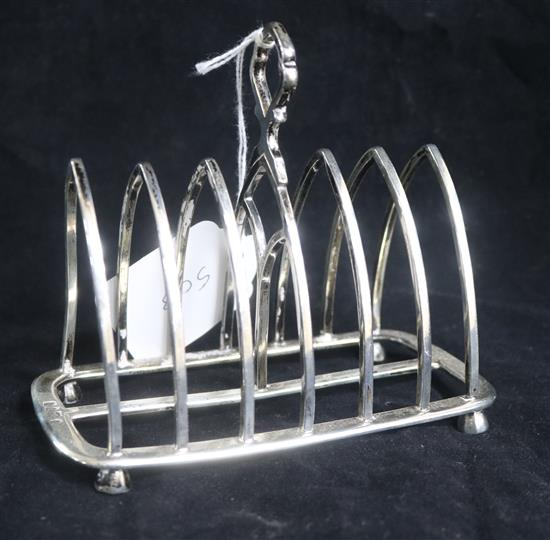 A George V silver seven bar toast rack by Thomas Bradbury & Sons, London, 1915.